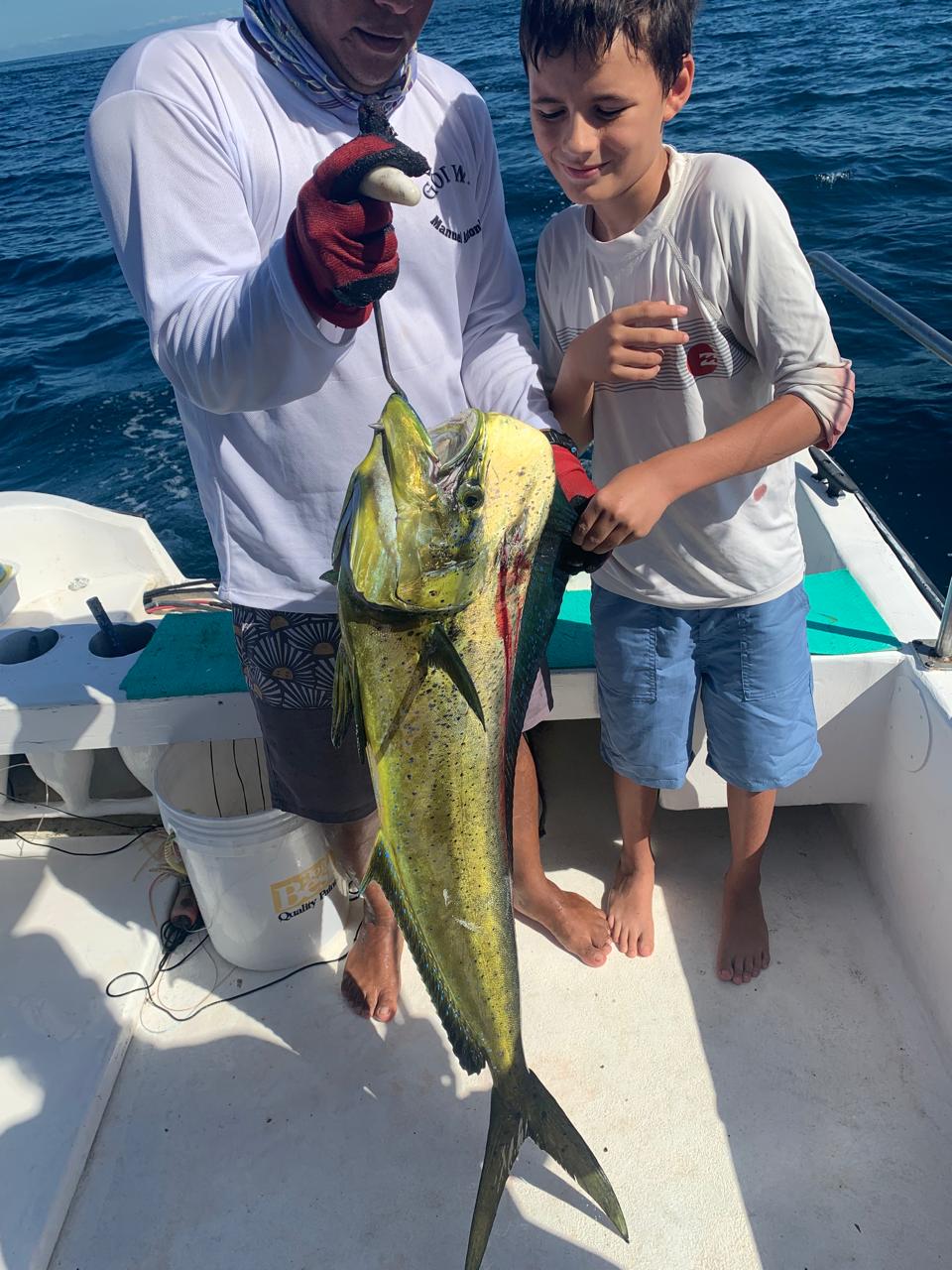 Kids fishing charter — dorado catch Costa Rica